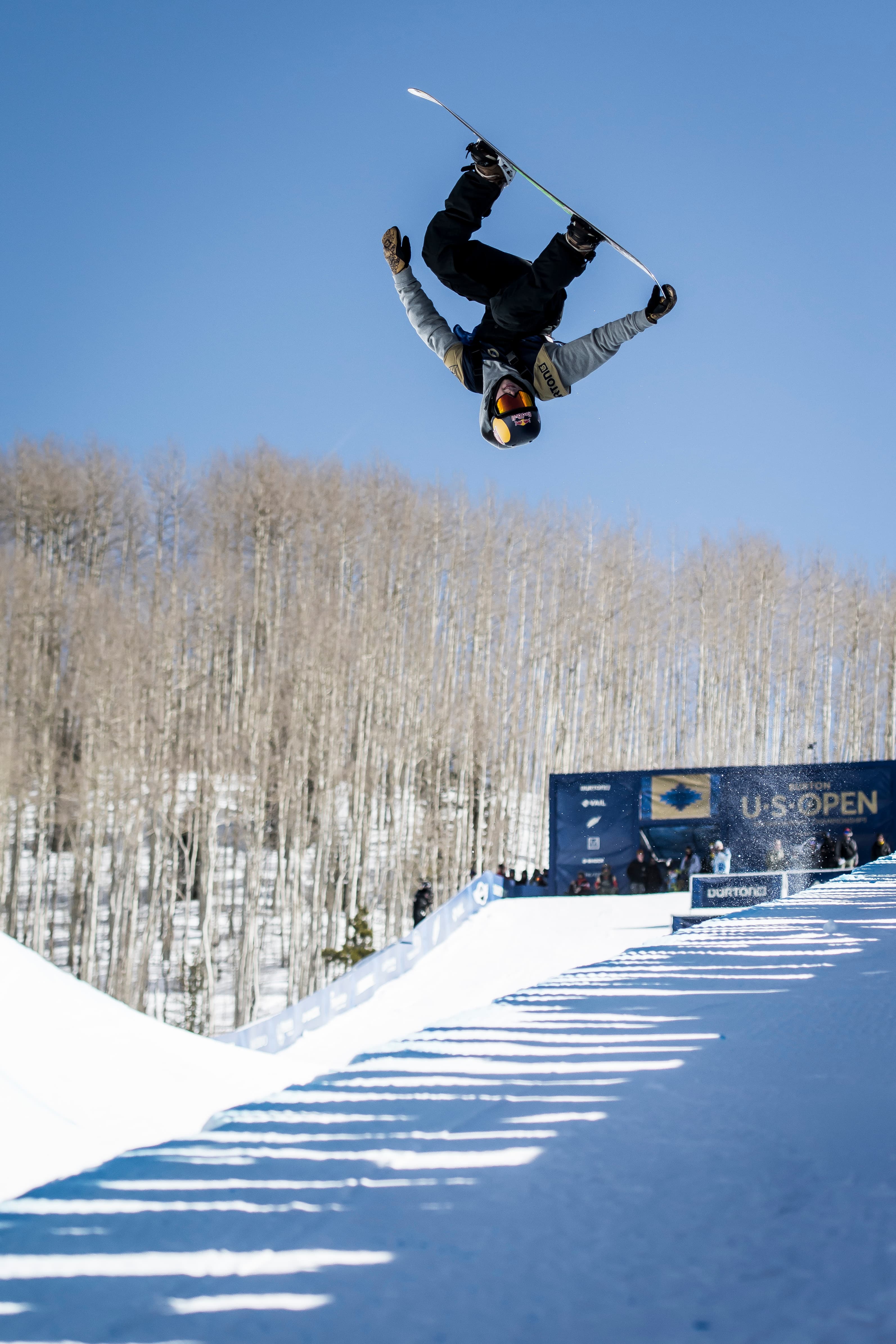 Snowboarder mid-flight at Burton US Open