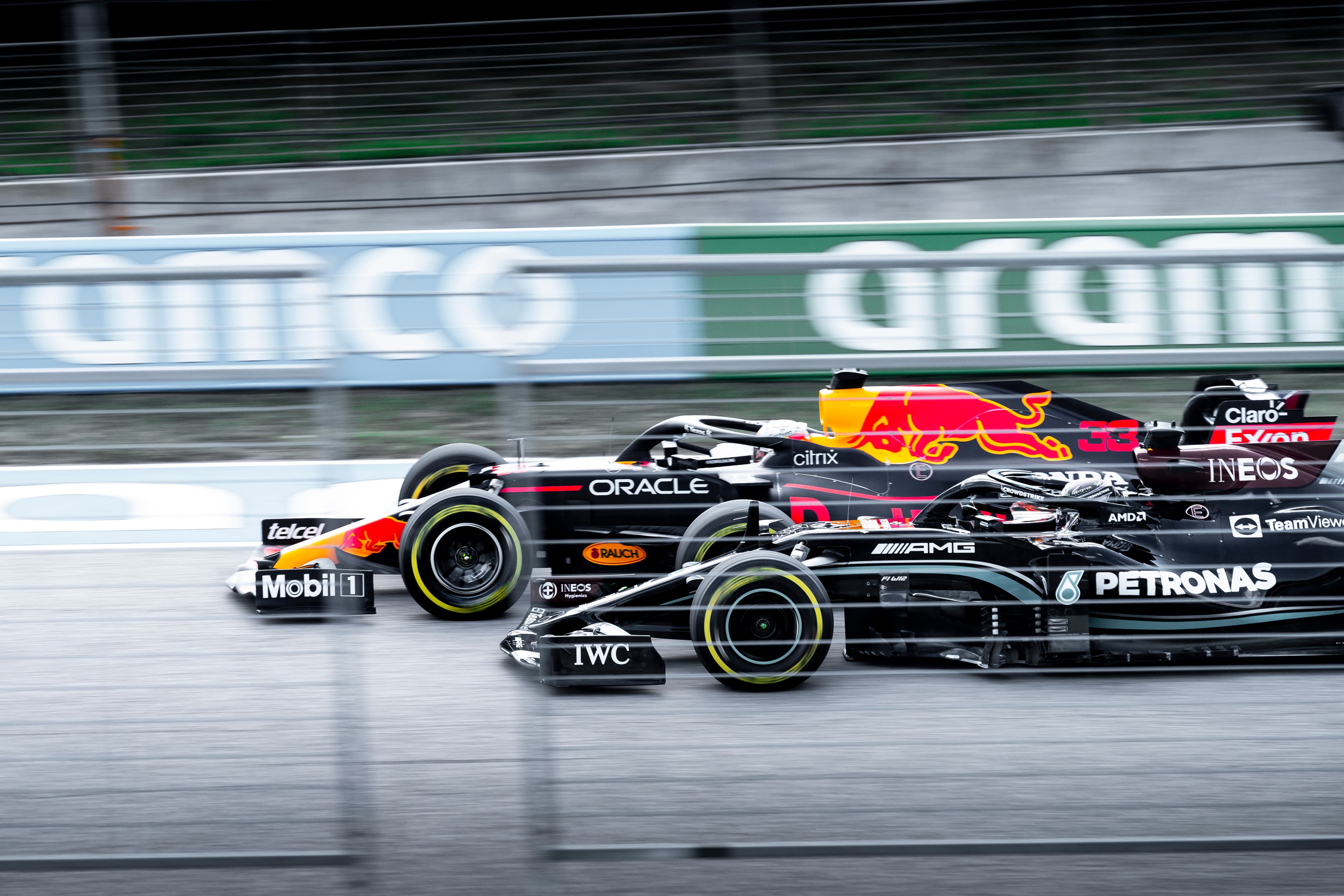 F1 drivers Max Verstappen and Lewis Hamilton trackside